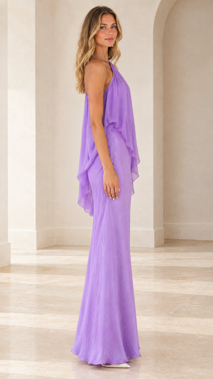 Side profile of lavender asymmetric capelet evening gown
