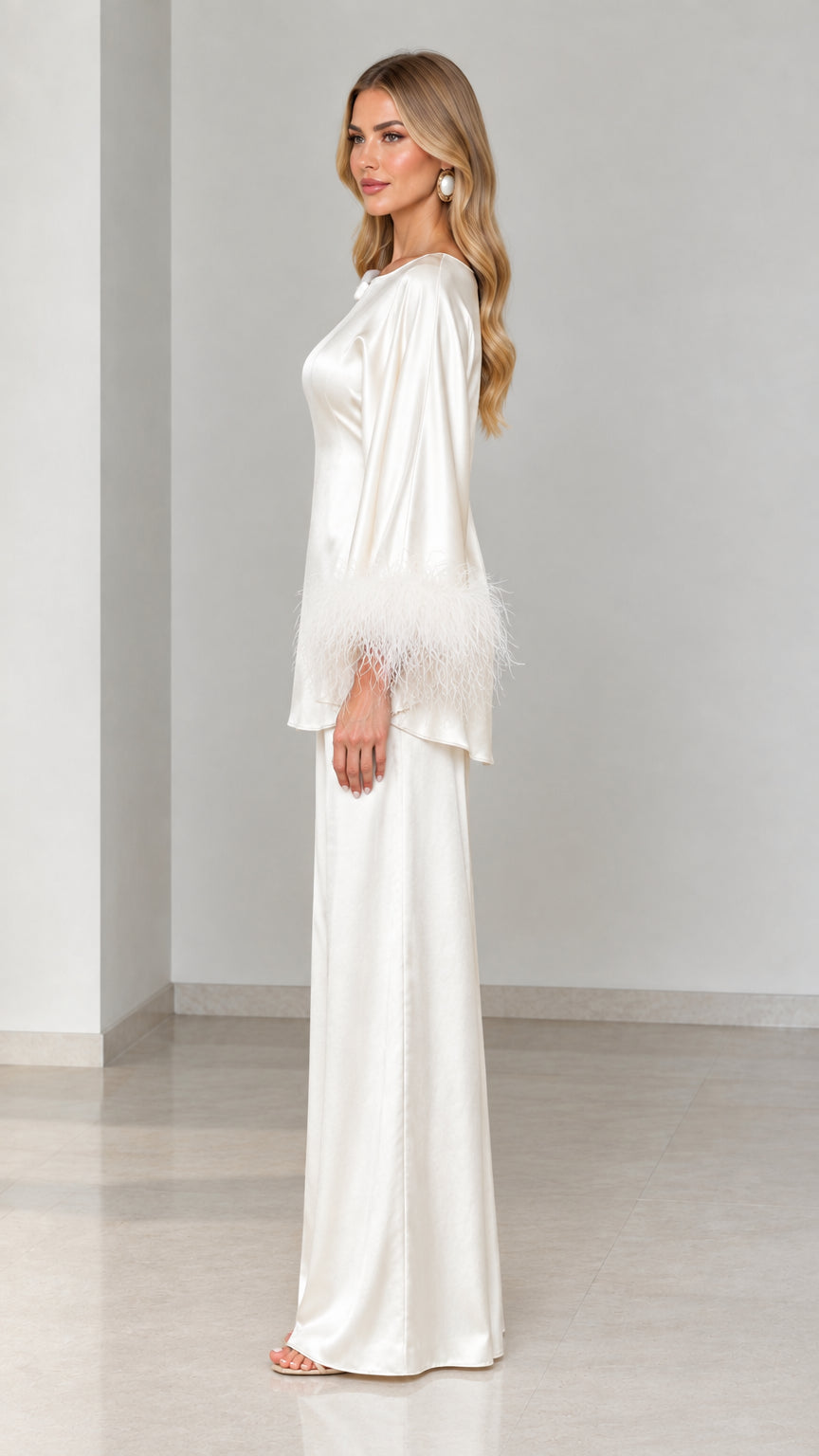 Side profile view of ivory satin tunic and wide-leg pant set