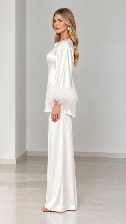 Side profile view of ivory satin tunic and wide-leg pant set