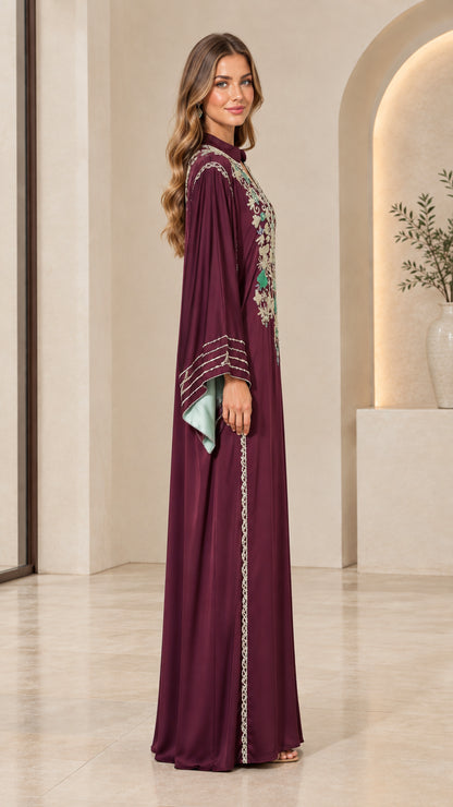 Side full-length view of burgundy embroidered long-sleeve maxi dress