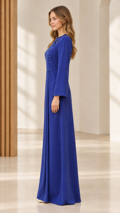 Side profile of royal blue pleated long sleeve formal maxi dress