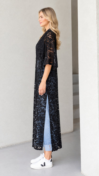 Side profile view of black floral lace maxi duster showing high side slit detail