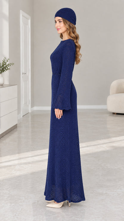 Side profile view of woman in Navy Blue textured long sleeve knit maxi dress