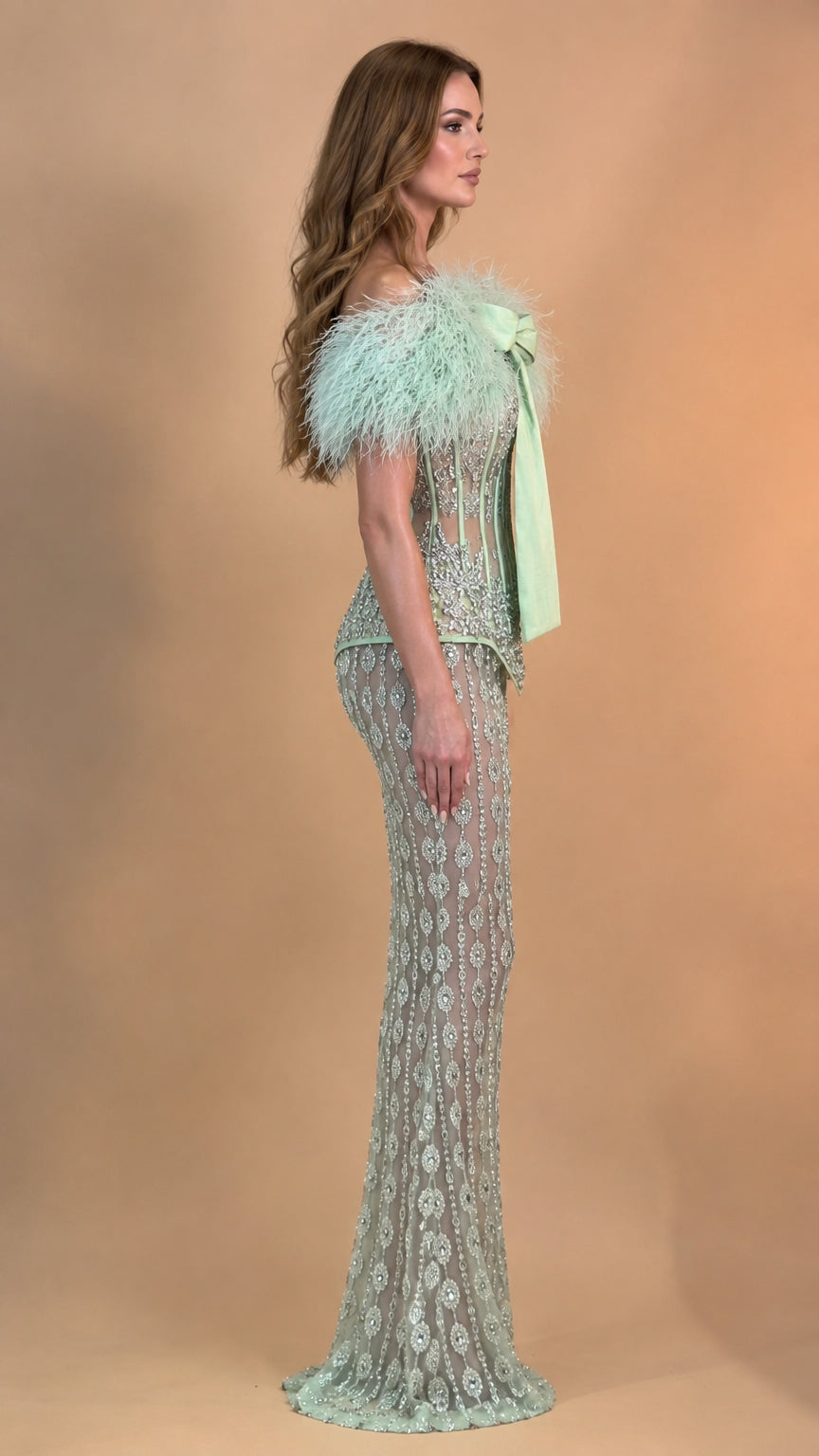 Side view of model in Mint Green feather off-shoulder embellished maxi dress