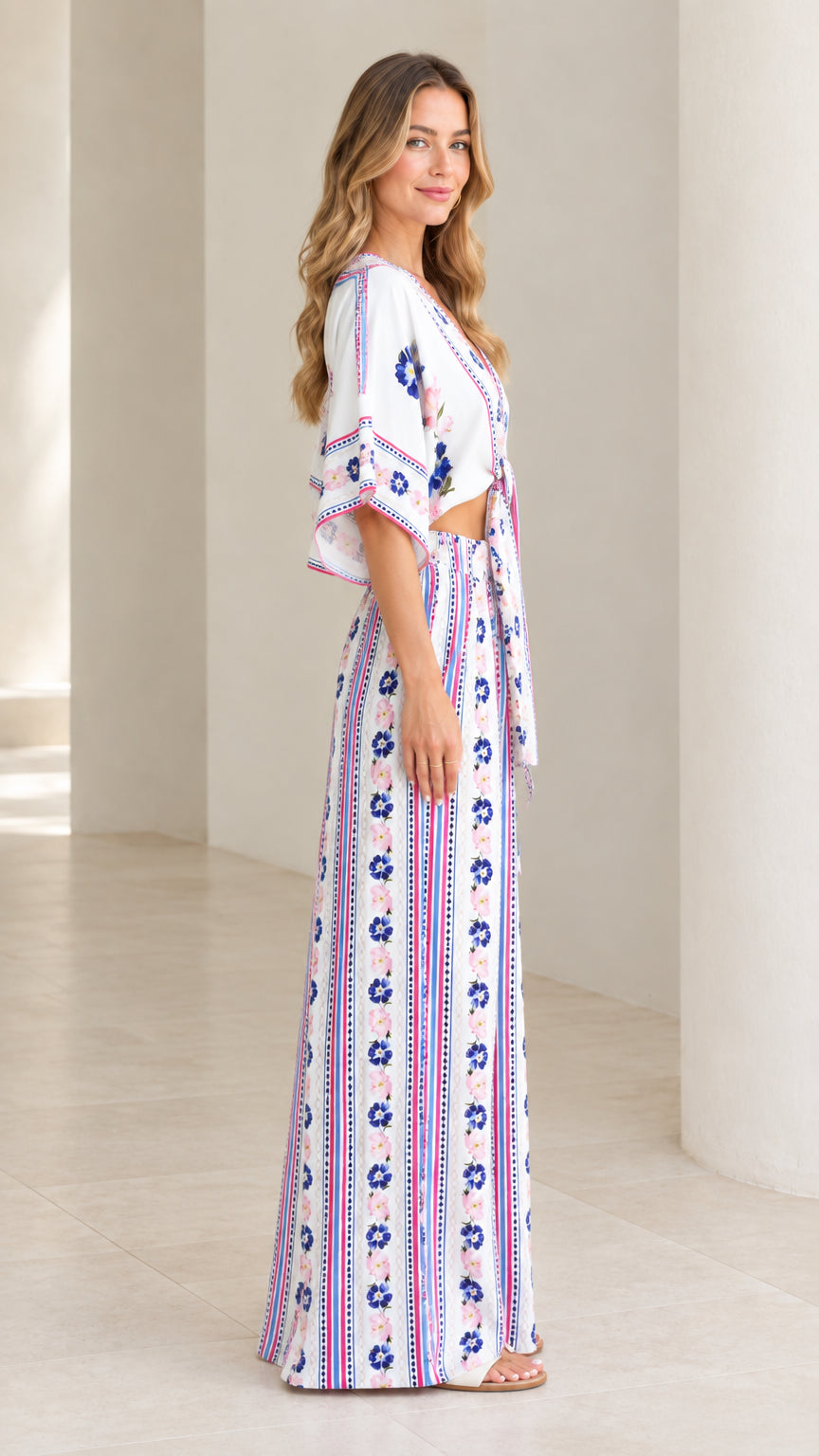 Side view of model in white floral boho two-piece pant set