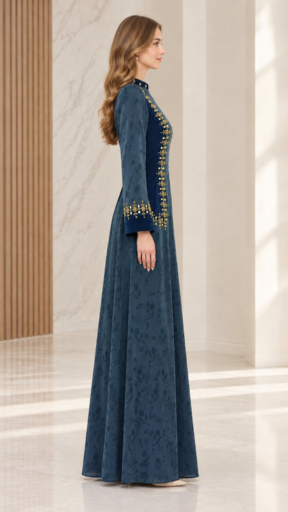 Side profile of woman wearing teal blue embroidered jacquard maxi dress