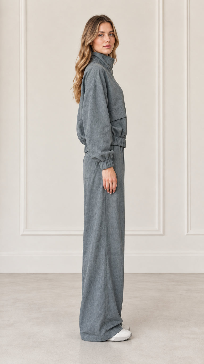 Side profile view of woman wearing Dusty Blue matching two-piece tracksuit set