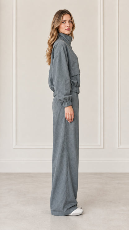 Side profile view of woman wearing Dusty Blue matching two-piece tracksuit set