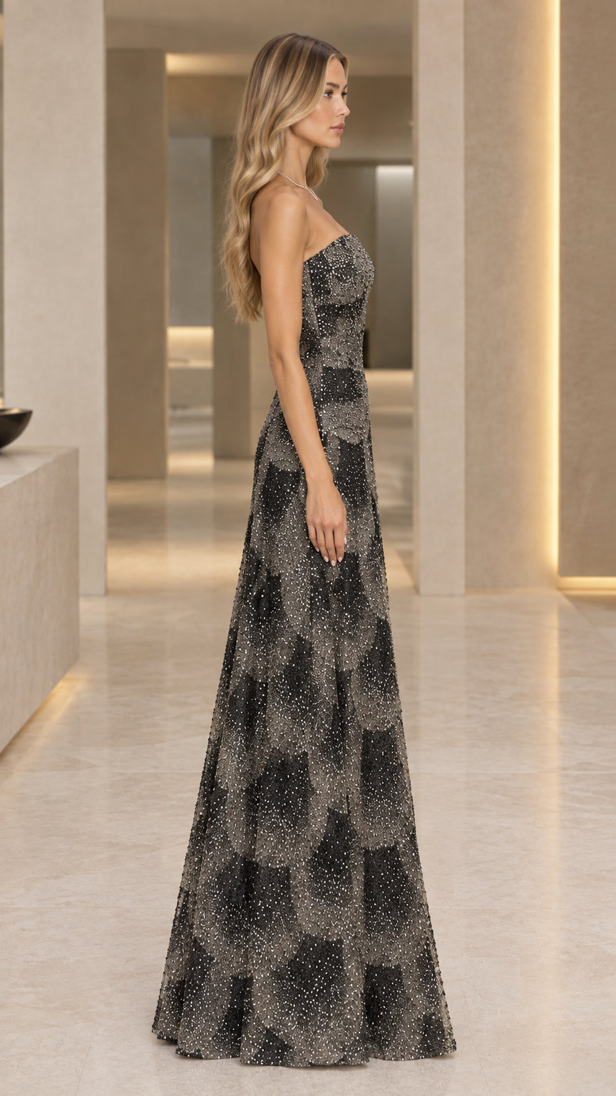 Side profile of black strapless formal shimmer gown