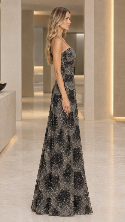 Side profile of black strapless formal shimmer gown