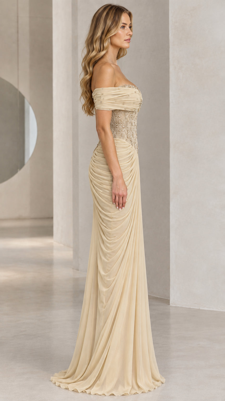Side profile of elegant champagne ruched maxi evening dress