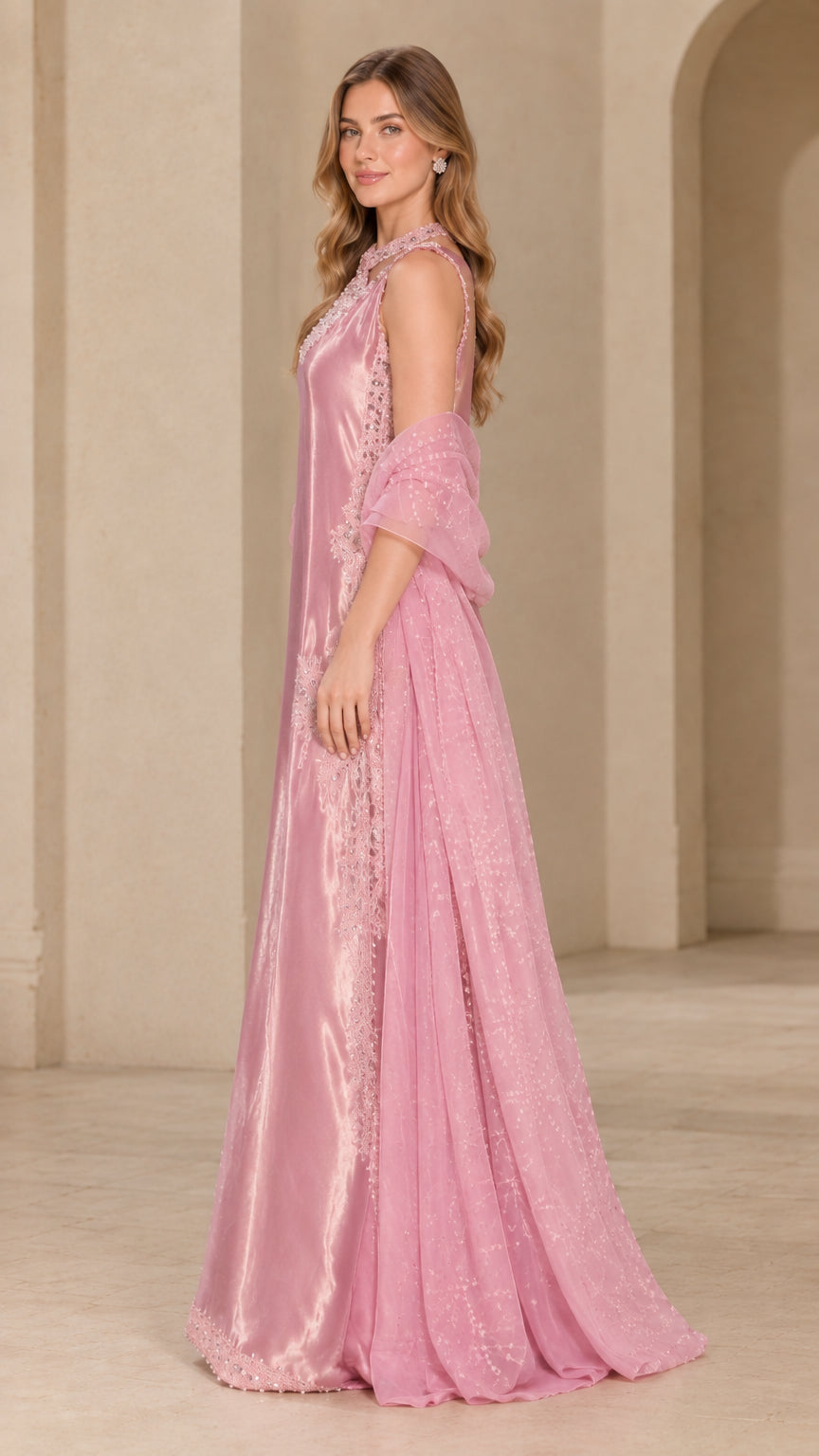 Side profile view of blush pink beaded satin maxi evening dress with draped wrap