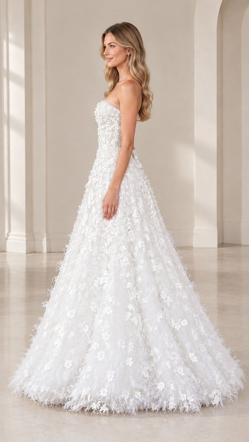 Side profile view of strapless white 3D floral evening dress