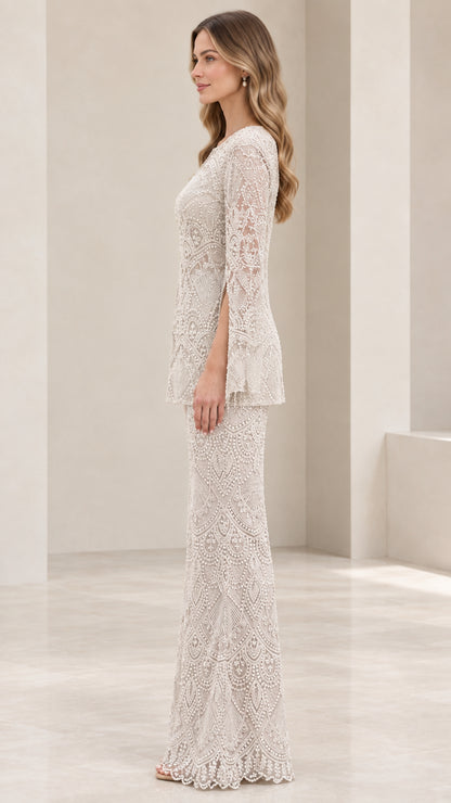 Side view of woman wearing champagne lace tunic and flared pant suit