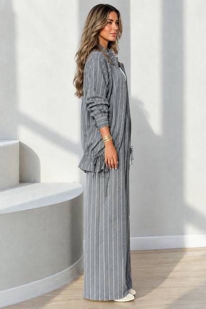 Side full-length view of grey pinstripe two-piece casual set