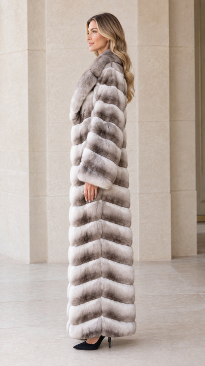 Side profile of woman in full-length grey ombre plush faux fur coat