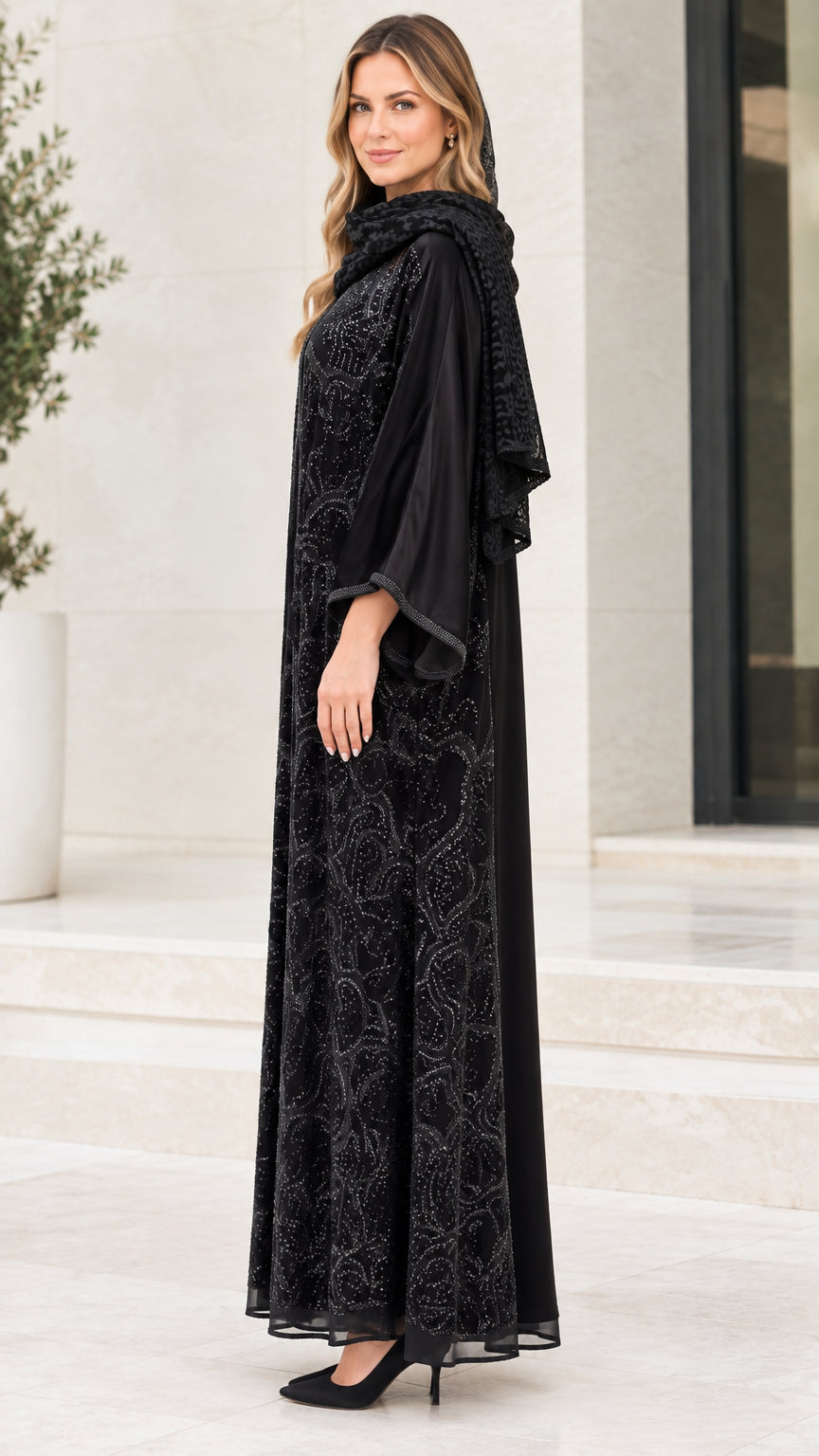 Side angle view of black sequined 3-piece abaya set showing flowing maxi length