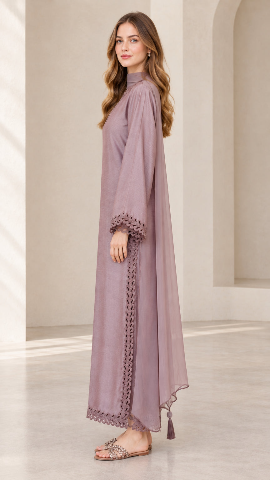 Side profile view of dusty mauve sheer layered maxi dress with tassel hem