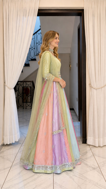 Side angle view of model wearing pastel multicolor flared ethnic maxi gown