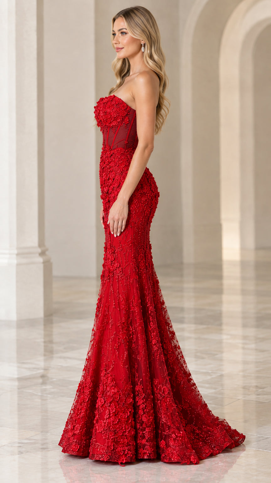Side profile view of woman modeling red floral applique mermaid gown