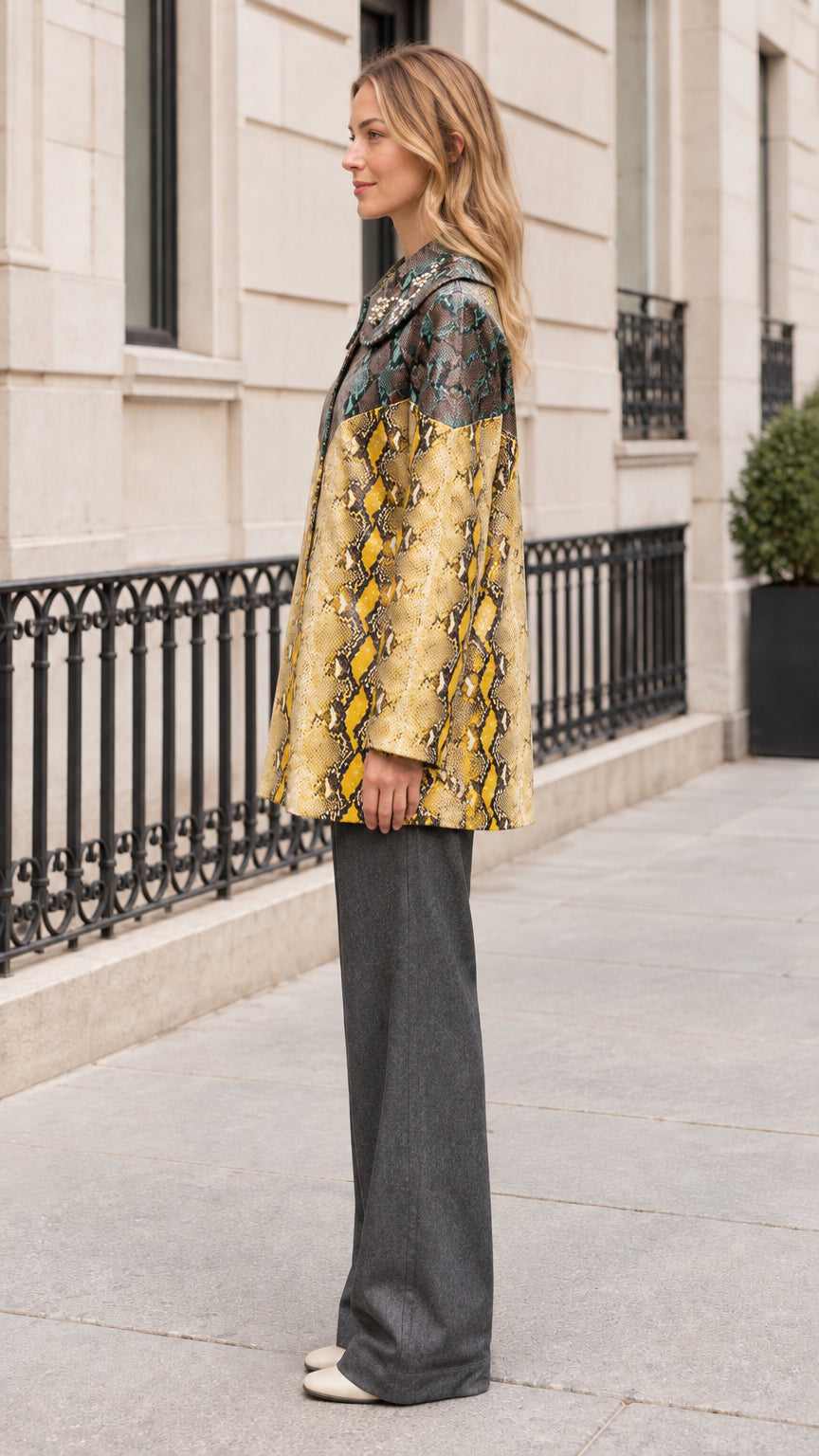 Side profile of model wearing Teal Yellow snake print jacket