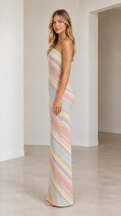Side profile of model in pastel multi one-shoulder striped column dress