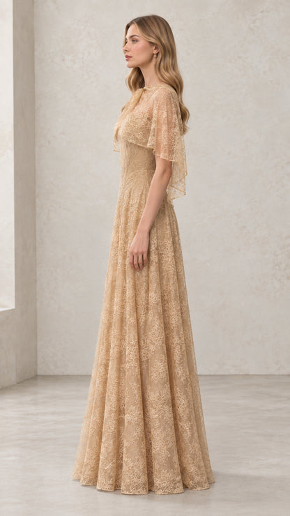 Side profile of woman in Champagne floral lace maxi dress with sheer capelet