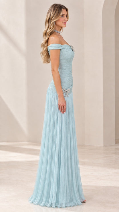 Side profile of ice blue formal maxi gown showing fitted ruched bodice and flowing skirt