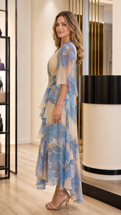 Side profile view of Beige Blue floral chiffon maxi gown showing tiered ruffles and flowing drape