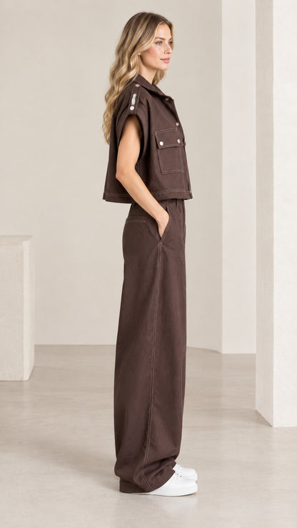 Side profile of woman in chocolate brown matching two-piece pant set