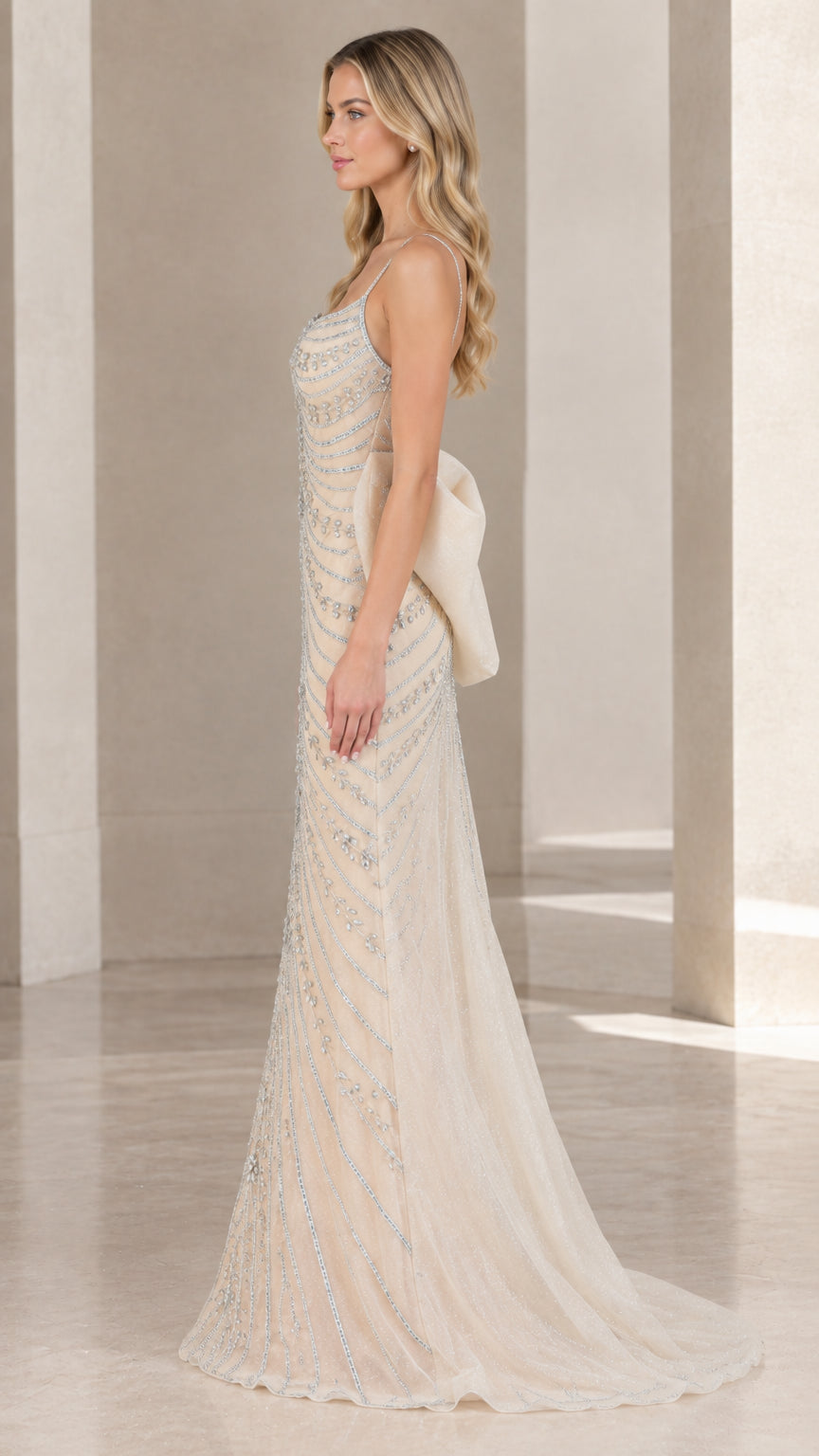 Side profile of champagne beaded formal gown showing slim silhouette