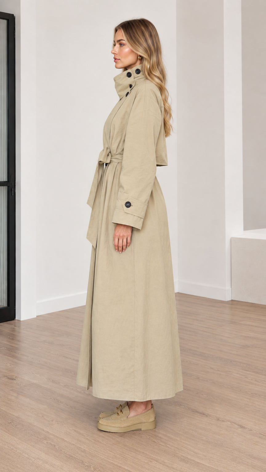 Side profile of women's long beige trench coat