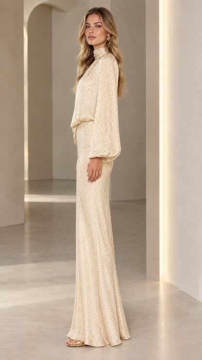 Side profile view of Champagne high neck lantern sleeve evening gown