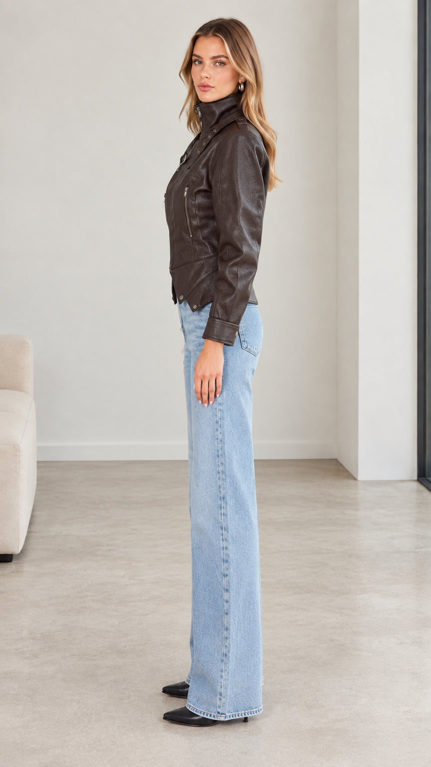 Side profile of model wearing dark brown faux leather moto jacket