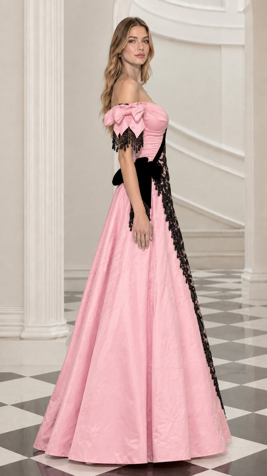 Side profile view of pink taffeta formal gown with asymmetric black lace overlay