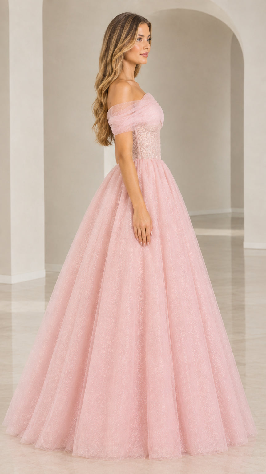 Side profile of model wearing Blush Pink shimmer tulle evening dress