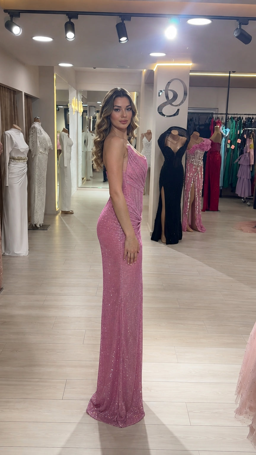 Side profile view of pink sequin evening gown showing slim silhouette