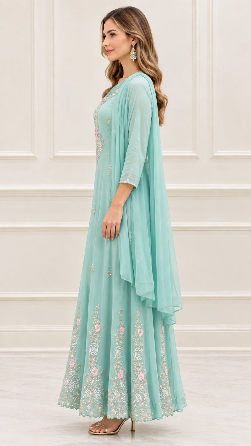 Side profile view of mint green embroidered flowy maxi dress