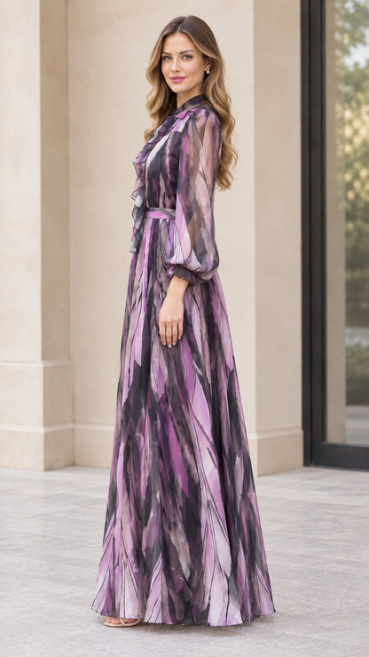 Side profile view of woman wearing purple abstract print long-sleeve maxi dress