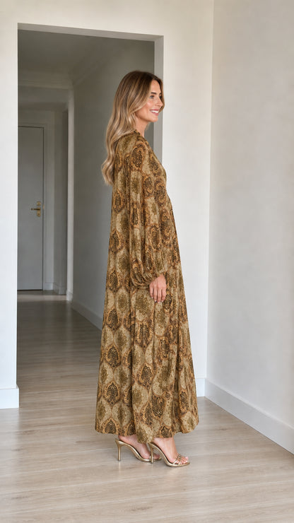 Side profile view of woman modeling Camel paisley print maxi kaftan dress