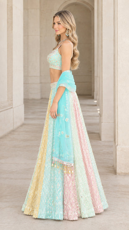 Side profile of model in pastel multicolor sequined panel lehenga set