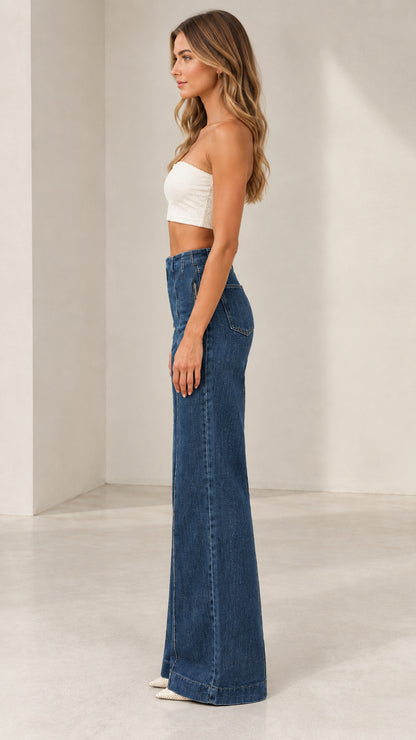 Side profile of model wearing Classic Blue high-waisted flare jeans