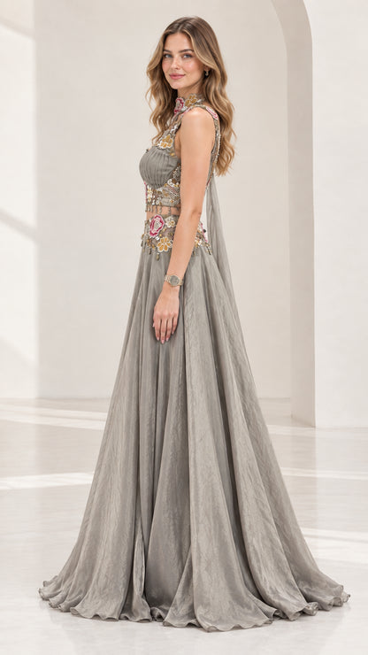 Side profile of silver grey two-piece formal dress with capelet drape