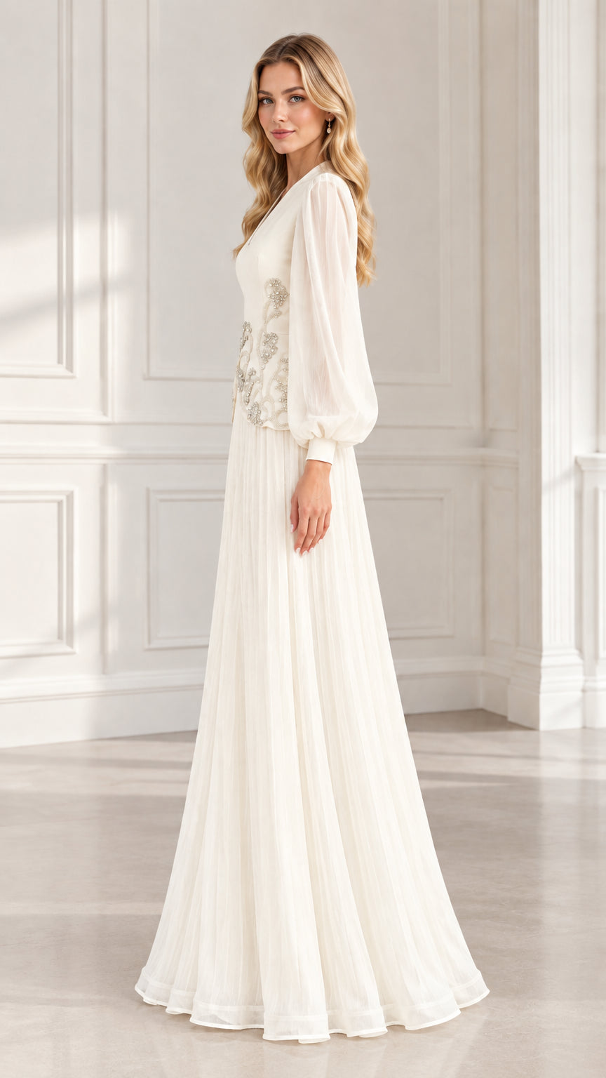 Side profile view of ivory pleated formal evening dress with long sheer sleeves