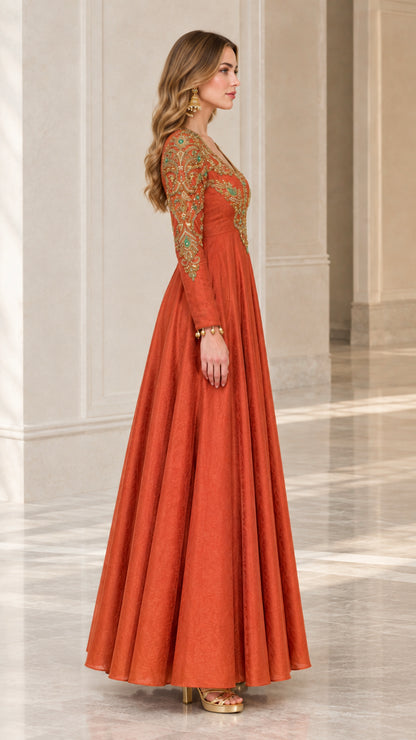 Side profile of woman wearing a Rust Orange floor length embroidered gown