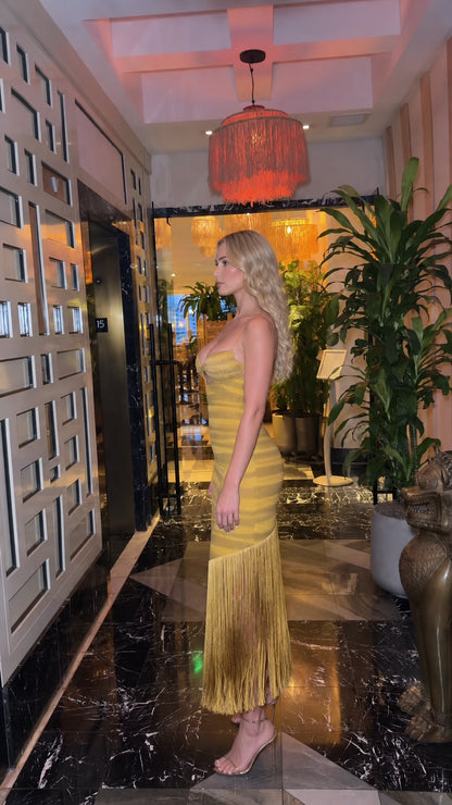 Side profile view of Mustard Yellow strappy fringe midi dress showing contoured fit