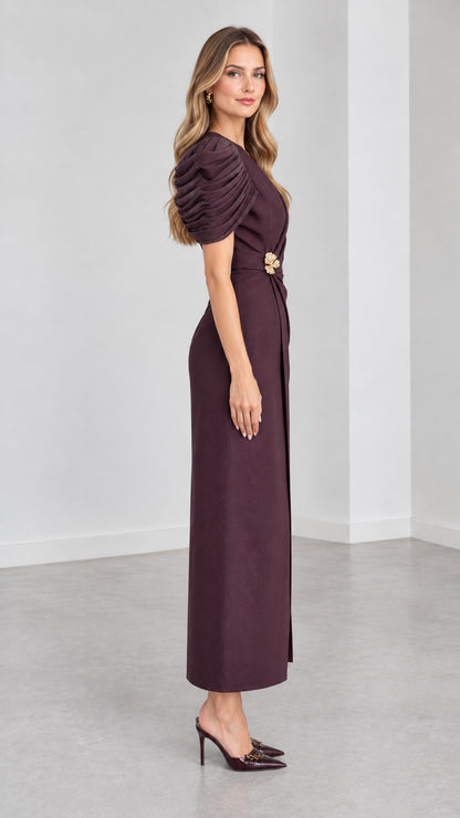 Side profile view of woman modeling Plum pleated sleeve tailored evening maxi dress