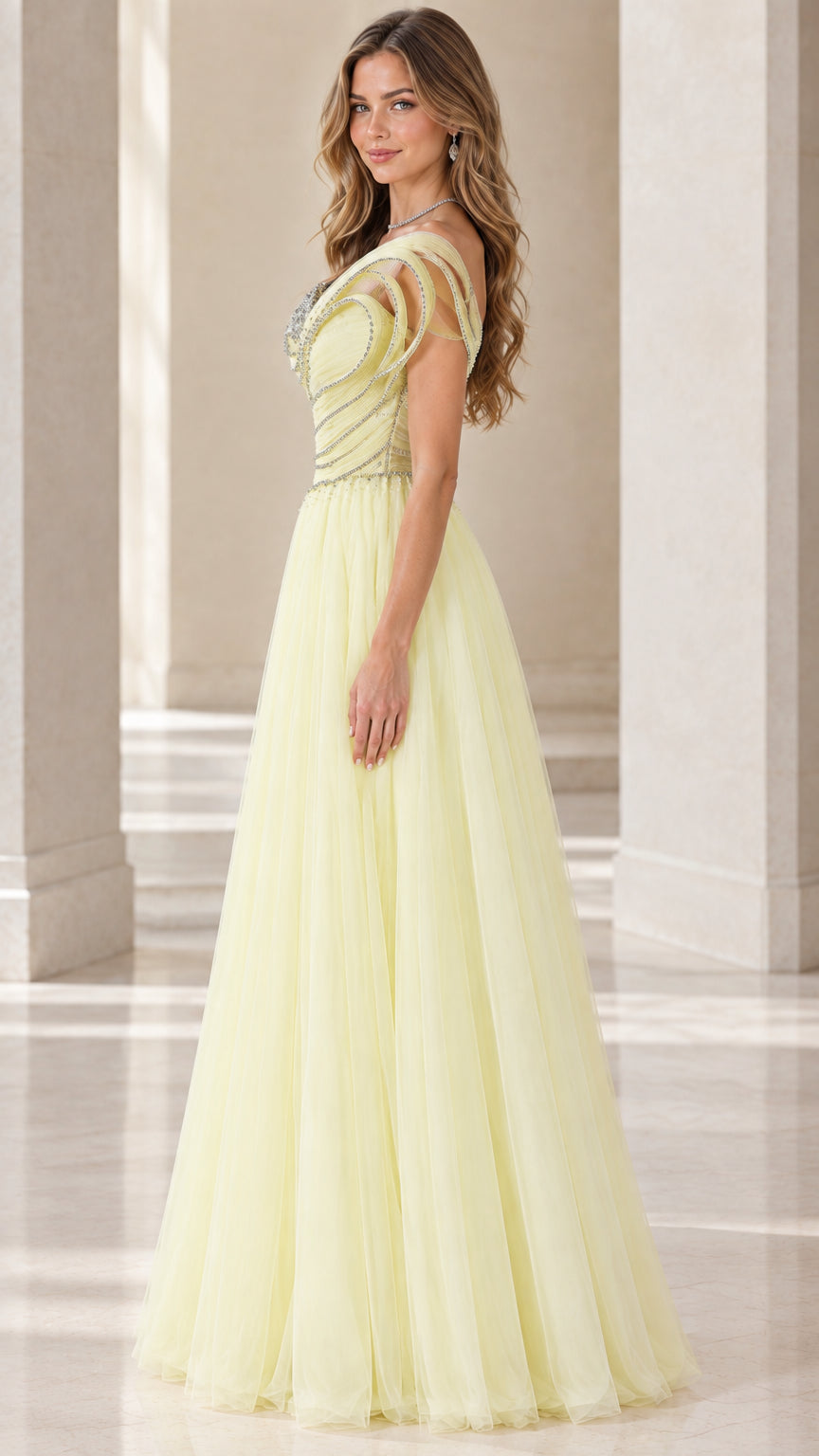 Side profile of model in pastel yellow one-shoulder pleated tulle formal gown