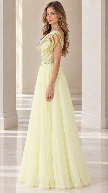 Side profile of model in pastel yellow one-shoulder pleated tulle formal gown
