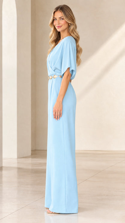 Side view of woman wearing light blue short-sleeve wide-leg jumpsuit